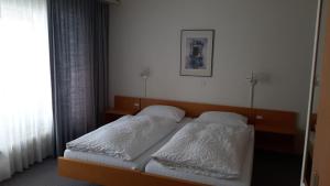 Postel nebo postele na pokoji v ubytování FeWo Fernsicht Crystal