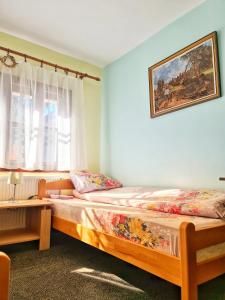 מיטה או מיטות בחדר ב-Etno domacinstvo Saponjic
