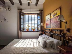 Cama o camas de una habitación en Hotel Fuente del Sol