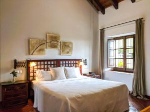 Cama o camas de una habitación en Hotel Fuente del Sol