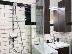 a bathroom with a shower and a sink at Abigél Vendégház Keszthely in Keszthely