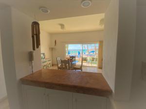 a kitchen with a counter top and a dining room at Casa de la Playa Fishermen in Playa del Carmen +9 photos