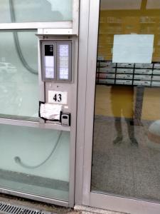 a machine in a store with a persons reflection in the window at AiRPORT ALEXANDER in Genoa