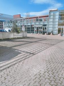 an empty parking lot in front of a building at AiRPORT HOUSE ALEXANDER in Genoa