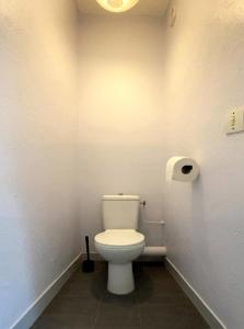 a bathroom with a white toilet in a room at Studio with terrace and sea view, 10 min to the beach in Nice
