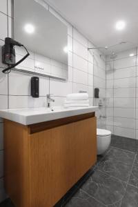 a bathroom with a sink and a toilet at N'Ala Otel in Sakarya