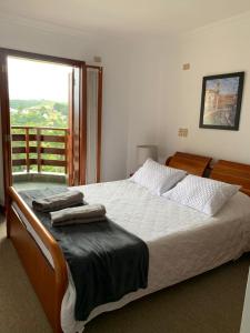 Un pat sau paturi într-o cameră la Ed Belvedere Lindo Apto Capivari 190m2