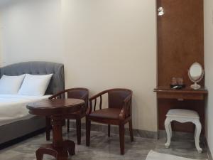 Postel nebo postele na pokoji v ubytování PEACE HOTEL
