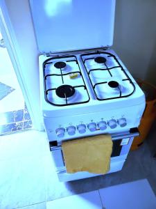 a stove is sitting in a kitchen with at Standard Gardens 1-2-3 bedrooms Apartment Kisumu in Kisumu