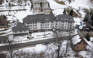a large building on top of a snow covered mountain at BELI VUK - Brzeće, Kopaonik in Brzeće