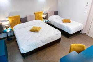 Postel nebo postele na pokoji v ubytování Hotel Eubea