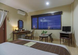 Televisor o centre d'entreteniment de The Jayakarta Suites Komodo Flores