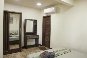 Postel nebo postele na pokoji v ubytování Daisy Cottage Dhangethi