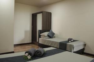 Postel nebo postele na pokoji v ubytování Daisy Cottage Dhangethi