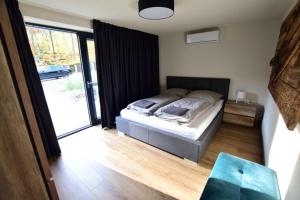 Posteľ alebo postele v izbe v ubytovaní Apartamenty Minimal House