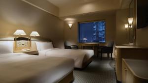 Postel nebo postele na pokoji v ubytování Hotel New Otani Makuhari