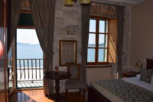 a room with a bed and a window at Heritage Boutique Hotel Adriatic-Adults only in Orebić