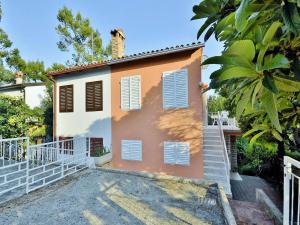 a house with a cat sitting on top of it at Apartments Miro 636 in Rovinj