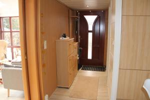 a hallway with a door leading into a room at Ferienhaus am Schwielochsee in Schwielochsee +46 photos