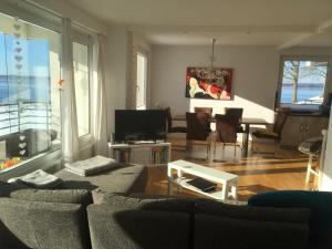 a living room with a couch and a table at Seaside in Schausende