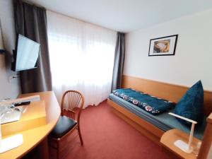 Postel nebo postele na pokoji v ubytování BodenSEE Gästehaus Tettnang ALBERGO