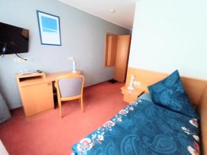 Postel nebo postele na pokoji v ubytování BodenSEE Gästehaus Tettnang ALBERGO