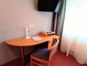 TV a/nebo společenská místnost v ubytování BodenSEE Gästehaus Tettnang ALBERGO