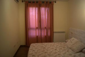 מיטה או מיטות בחדר ב-Apartamento VUT manypi VU-HUESCA-21-024