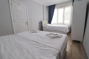 Krevet ili kreveti u jedinici u objektu Karaköy VAV Suites