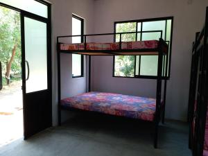 Våningssäng eller våningssängar i ett rum på The Boundary Yala
