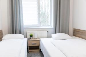 Łóżko lub łóżka w pokoju w obiekcie Hotel Górecki