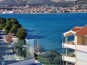 a view of the water from the balcony of a building at Grand Palace in Trogir