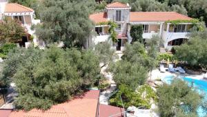 an aerial view of a house with a swimming pool and trees at Resort "Maslinjak" in Budva