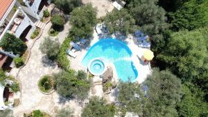 an overhead view of a swimming pool in a resort at Resort "Maslinjak" in Budva