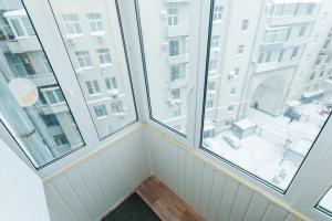 a room with two large windows in a building at Tverskaya 17 in Moscow