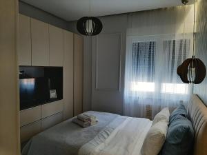 Postel nebo postele na pokoji v ubytování Stefan Lux Apartment