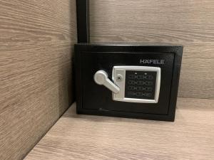 an electrical outlet with a cell phone in it at NAC SUITES in Porpetto