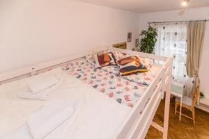 En eller flere senge i et værelse på Zen Studio