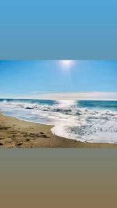 a view of a beach with the ocean at U Morya Guesthouse in Sukhum