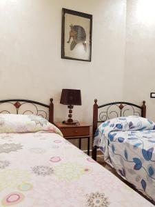Un pat sau paturi într-o cameră la Residence Niama C