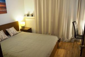 Säng eller sängar i ett rum på Wilanów Apartment close to Town Hall and Palace