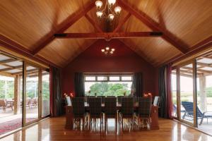 a dining room with a table and chairs at Hiwinui Country Estate in Palmerston North