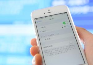 a person holding a cell phone in their hand at APA Hotel Yodoyabashi Kitahama Ekimae in Osaka