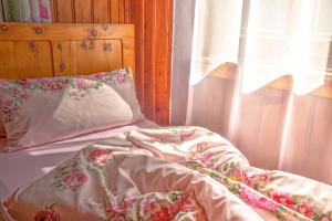 A bed or beds in a room at Chalet Rastenhof - Urlaub auf dem Bauernhof in Österreich