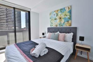 Postel nebo postele na pokoji v ubytování MY80 Apartment located in the inner of Melbourne CBD