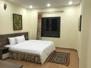 Voodi või voodid majutusasutuse Ngoc Tran Hotel toas