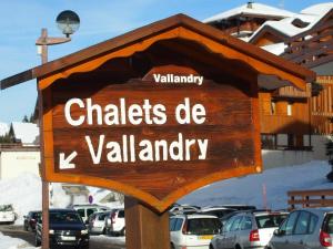 a sign that says chates de kvalancy in a parking lot at Charming chalet with view on Mont Blanc in Peisey-Nancroix
