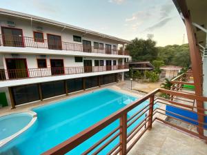 a view from the balcony of a hotel with a swimming pool at Cerca Parola Beach Resort in Malabrigo