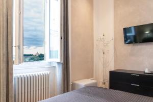 TV a/nebo společenská místnost v ubytování Residence Sferisterio