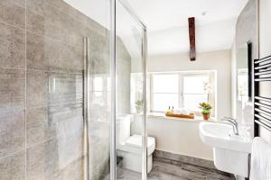 a bathroom with a shower and a toilet and a sink at Shoulder of Mutton Inn in Harrogate +44 photos